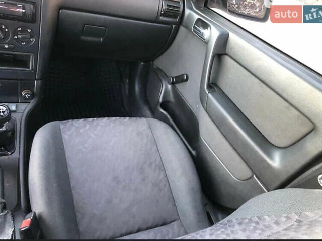 Серый Опель Астра, объемом двигателя 1.6 л и пробегом 244 тыс. км за 3000 $, фото 11 на Automoto.ua