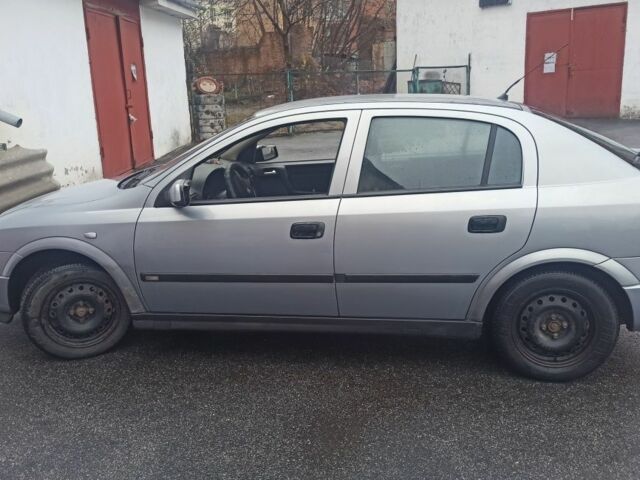 Серый Опель Астра, объемом двигателя 1.6 л и пробегом 214 тыс. км за 3400 $, фото 1 на Automoto.ua