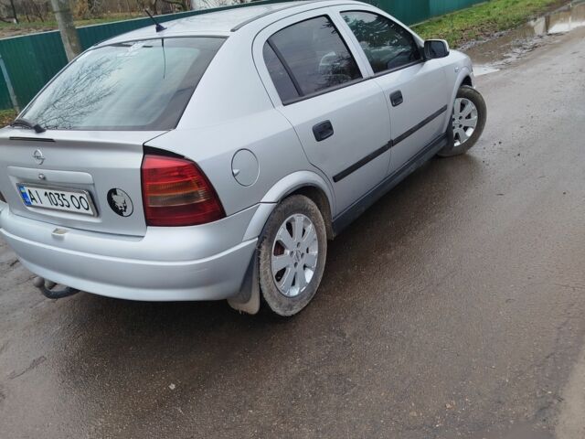 Серый Опель Астра, объемом двигателя 1.2 л и пробегом 249 тыс. км за 2400 $, фото 1 на Automoto.ua