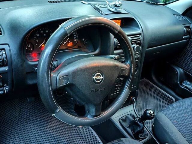 Серый Опель Астра, объемом двигателя 1.6 л и пробегом 180 тыс. км за 4730 $, фото 6 на Automoto.ua