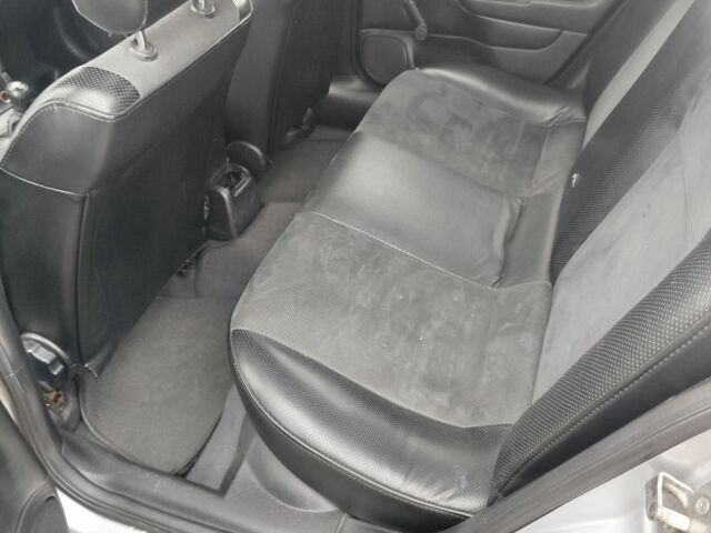 Серый Опель Астра, объемом двигателя 1.2 л и пробегом 249 тыс. км за 2400 $, фото 8 на Automoto.ua