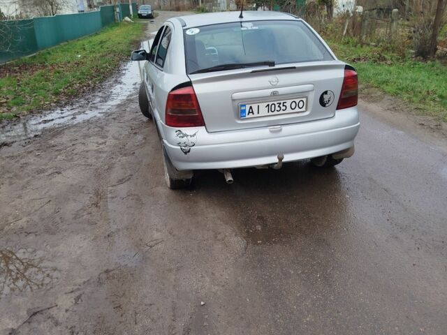 Серый Опель Астра, объемом двигателя 1.2 л и пробегом 249 тыс. км за 2400 $, фото 2 на Automoto.ua