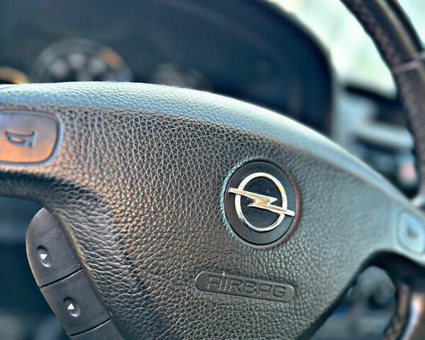 Серый Опель Астра, объемом двигателя 1.6 л и пробегом 110 тыс. км за 2800 $, фото 39 на Automoto.ua