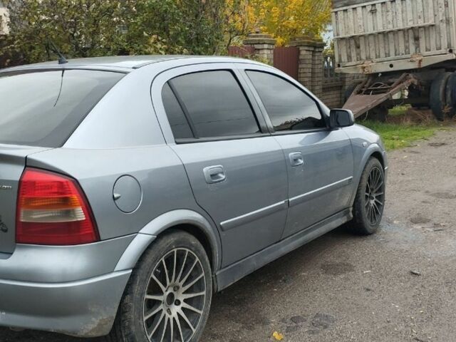 Серый Опель Астра, объемом двигателя 2 л и пробегом 245 тыс. км за 1200 $, фото 2 на Automoto.ua