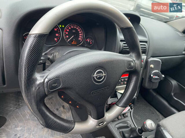 Серый Опель Астра, объемом двигателя 2 л и пробегом 185 тыс. км за 6800 $, фото 10 на Automoto.ua