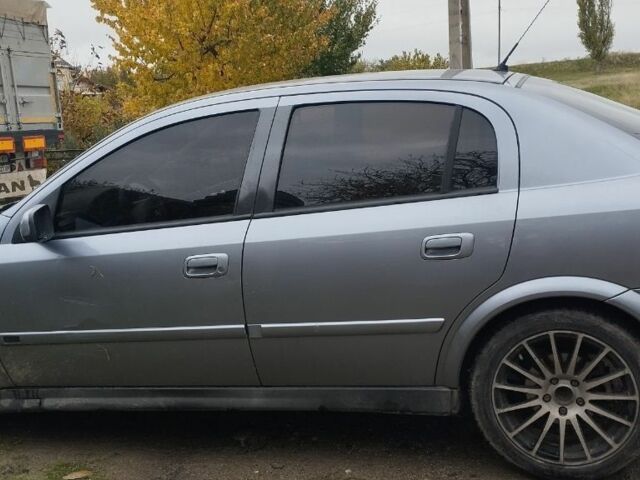 Серый Опель Астра, объемом двигателя 2 л и пробегом 245 тыс. км за 1200 $, фото 1 на Automoto.ua
