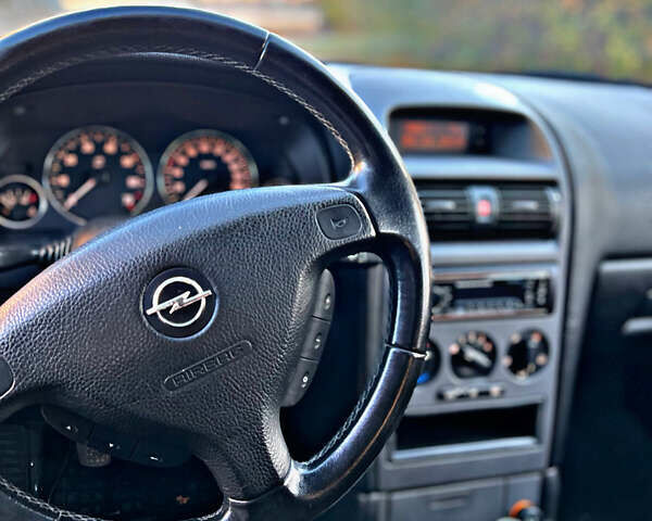 Серый Опель Астра, объемом двигателя 1.6 л и пробегом 110 тыс. км за 2800 $, фото 20 на Automoto.ua