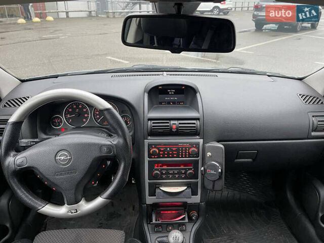 Серый Опель Астра, объемом двигателя 2 л и пробегом 185 тыс. км за 6800 $, фото 9 на Automoto.ua