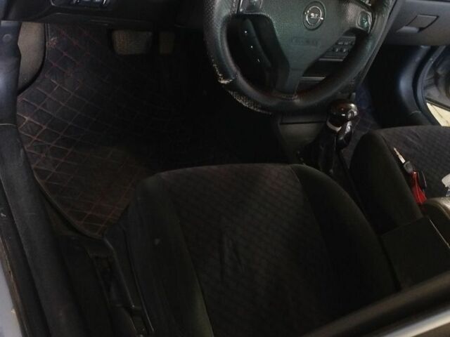 Серый Опель Астра, объемом двигателя 2 л и пробегом 245 тыс. км за 1200 $, фото 6 на Automoto.ua