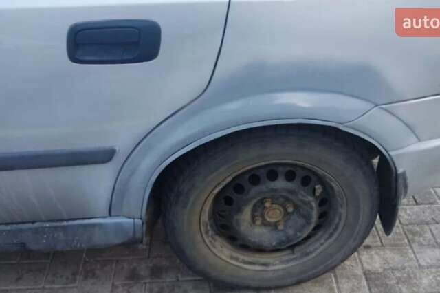 Серый Опель Астра, объемом двигателя 1.6 л и пробегом 254 тыс. км за 2050 $, фото 2 на Automoto.ua