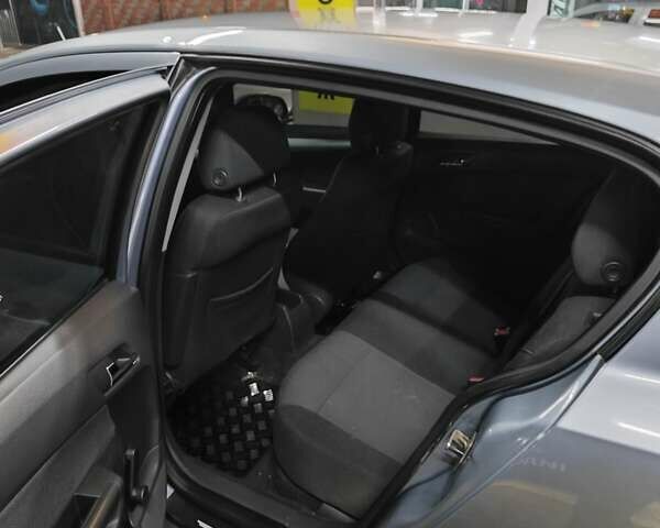 Серый Опель Астра, объемом двигателя 1.4 л и пробегом 257 тыс. км за 4499 $, фото 3 на Automoto.ua