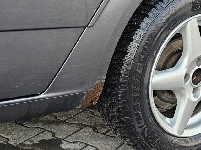 Серый Опель Астра, объемом двигателя 1.4 л и пробегом 191 тыс. км за 3700 $, фото 3 на Automoto.ua