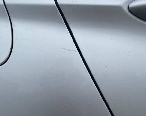 Серый Опель Астра, объемом двигателя 1.4 л и пробегом 160 тыс. км за 10000 $, фото 13 на Automoto.ua