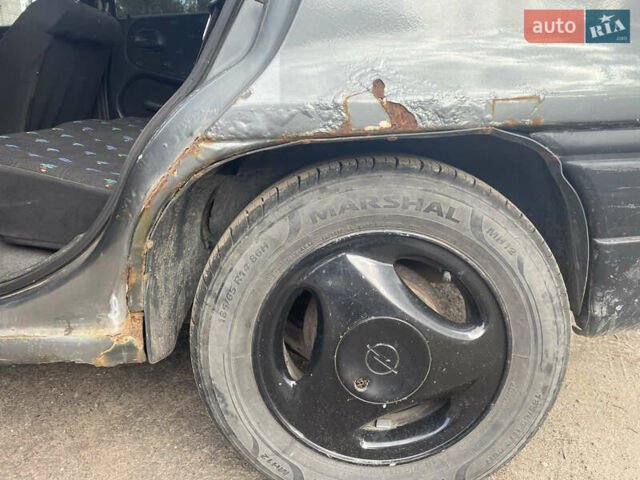 Серый Опель Астра, объемом двигателя 1.8 л и пробегом 558 тыс. км за 1000 $, фото 8 на Automoto.ua