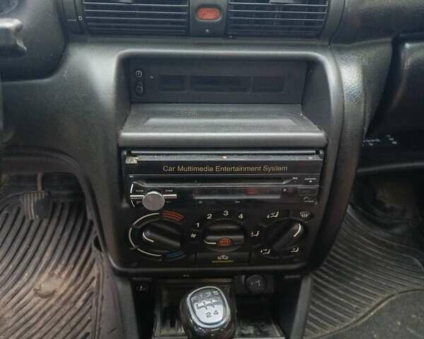 Серый Опель Астра, объемом двигателя 1.4 л и пробегом 185 тыс. км за 1400 $, фото 4 на Automoto.ua