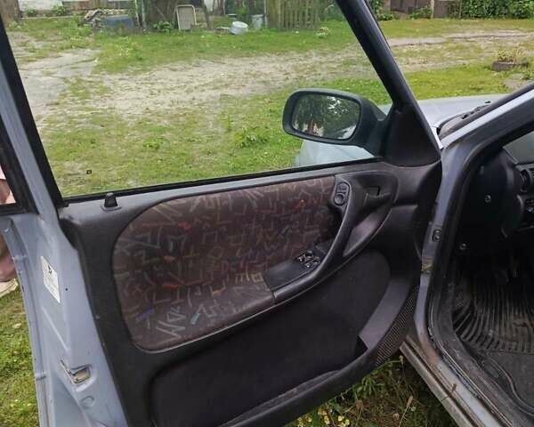 Серый Опель Астра, объемом двигателя 1.4 л и пробегом 185 тыс. км за 1400 $, фото 5 на Automoto.ua