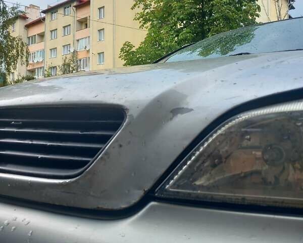 Серый Опель Астра, объемом двигателя 1.6 л и пробегом 220 тыс. км за 3000 $, фото 3 на Automoto.ua