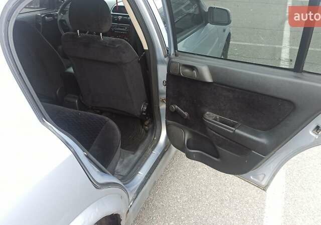 Серый Опель Астра, объемом двигателя 1.6 л и пробегом 235 тыс. км за 2500 $, фото 9 на Automoto.ua