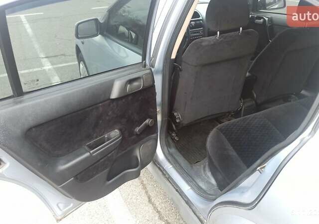 Серый Опель Астра, объемом двигателя 1.6 л и пробегом 235 тыс. км за 2500 $, фото 6 на Automoto.ua