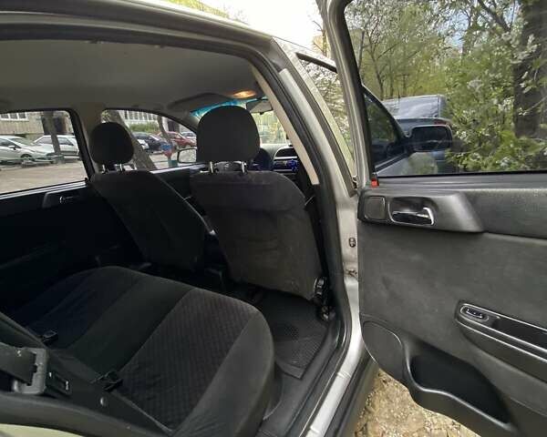 Серый Опель Астра, объемом двигателя 1.6 л и пробегом 248 тыс. км за 4000 $, фото 3 на Automoto.ua