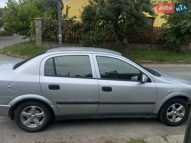 Серый Опель Астра, объемом двигателя 1.4 л и пробегом 310 тыс. км за 3200 $, фото 2 на Automoto.ua