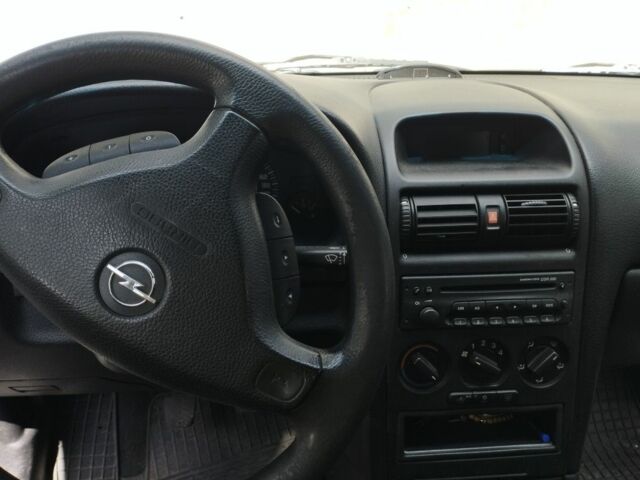 Серый Опель Астра, объемом двигателя 1.6 л и пробегом 231 тыс. км за 3000 $, фото 11 на Automoto.ua