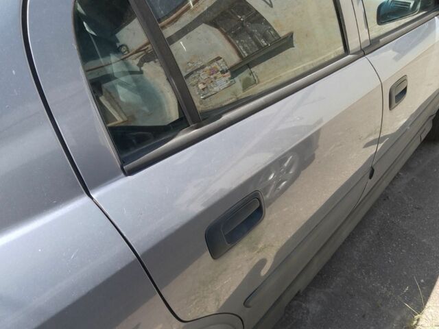 Серый Опель Астра, объемом двигателя 1.6 л и пробегом 231 тыс. км за 3000 $, фото 4 на Automoto.ua