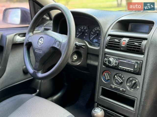 Серый Опель Астра, объемом двигателя 1.4 л и пробегом 228 тыс. км за 2899 $, фото 23 на Automoto.ua