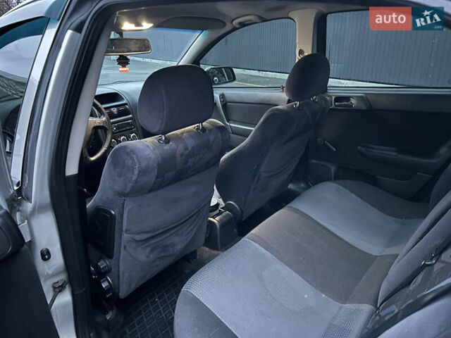 Серый Опель Астра, объемом двигателя 1.4 л и пробегом 269 тыс. км за 2200 $, фото 11 на Automoto.ua