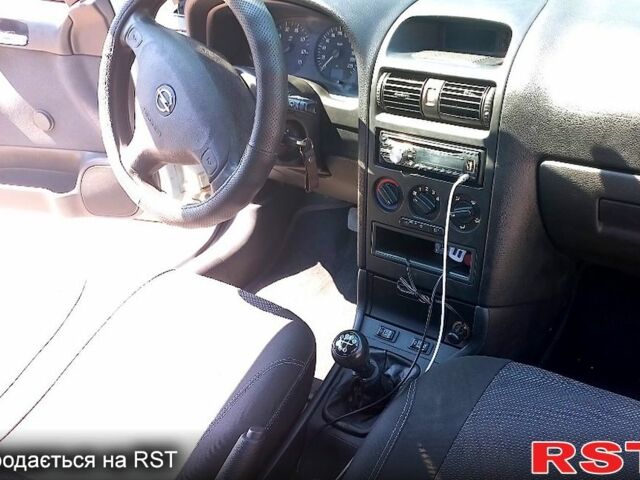 Серый Опель Астра, объемом двигателя 1.4 л и пробегом 215 тыс. км за 3800 $, фото 2 на Automoto.ua