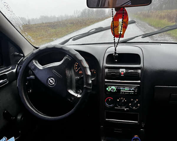 Серый Опель Астра, объемом двигателя 1.39 л и пробегом 223 тыс. км за 3800 $, фото 7 на Automoto.ua