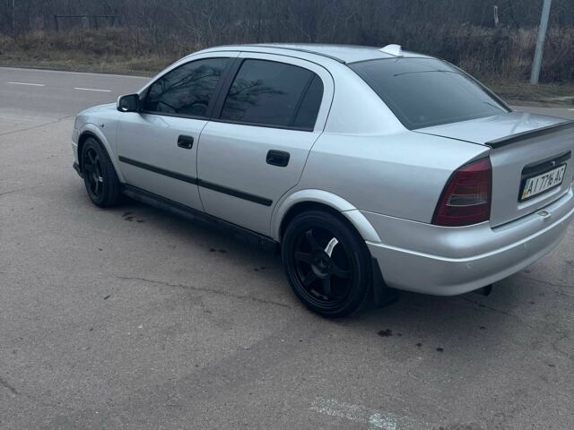 Серый Опель Астра, объемом двигателя 1.4 л и пробегом 300 тыс. км за 5000 $, фото 7 на Automoto.ua