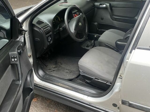 Серый Опель Астра, объемом двигателя 1.4 л и пробегом 348 тыс. км за 2950 $, фото 7 на Automoto.ua