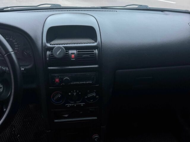 Серый Опель Астра, объемом двигателя 1.4 л и пробегом 300 тыс. км за 5000 $, фото 9 на Automoto.ua