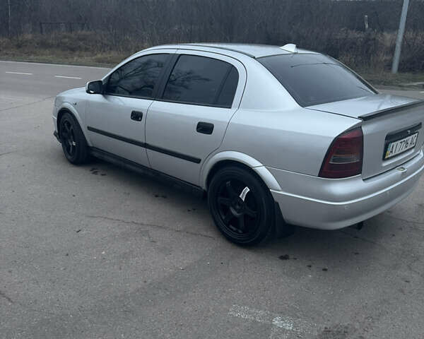 Серый Опель Астра, объемом двигателя 1.4 л и пробегом 300 тыс. км за 5000 $, фото 8 на Automoto.ua