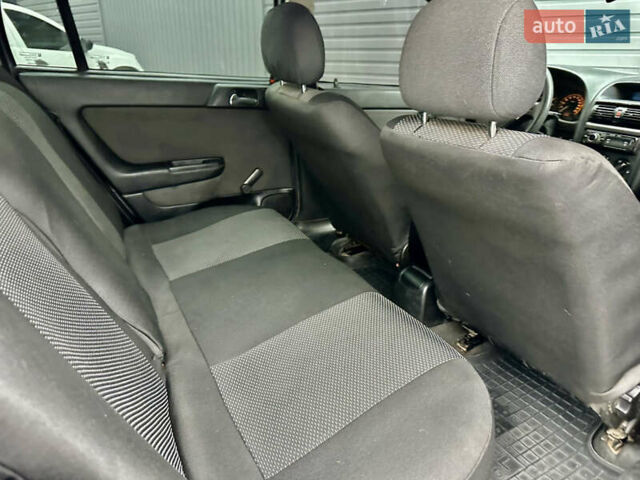 Серый Опель Астра, объемом двигателя 1.39 л и пробегом 240 тыс. км за 2800 $, фото 10 на Automoto.ua