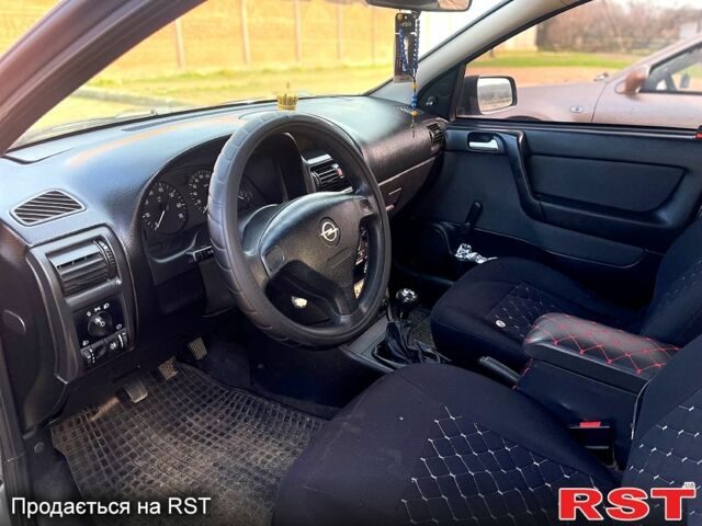 Серый Опель Астра, объемом двигателя 1.4 л и пробегом 212 тыс. км за 3000 $, фото 6 на Automoto.ua