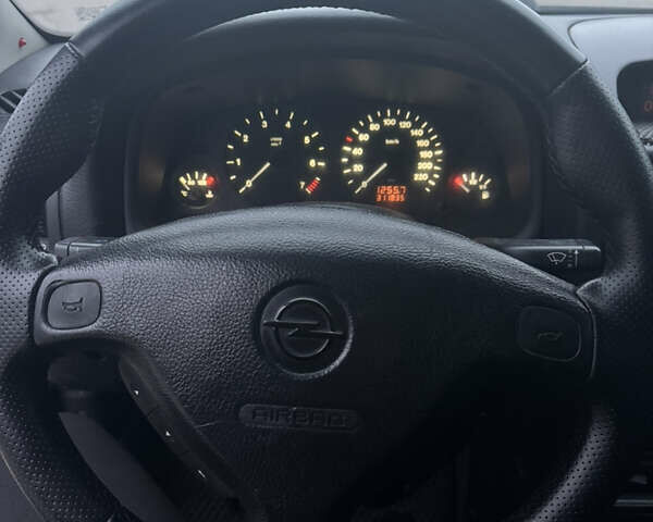 Серый Опель Астра, объемом двигателя 1.4 л и пробегом 300 тыс. км за 5000 $, фото 11 на Automoto.ua