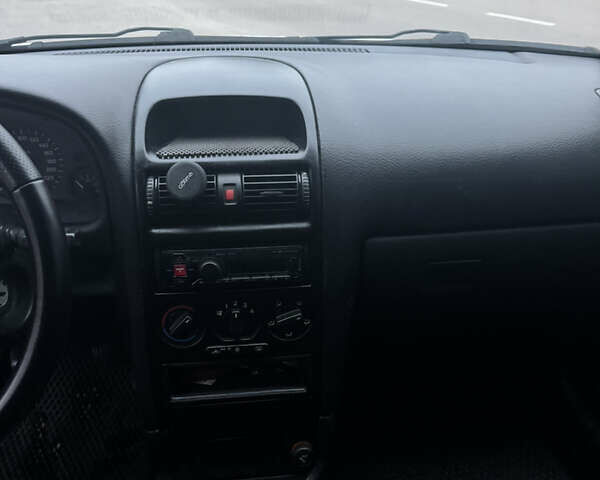 Серый Опель Астра, объемом двигателя 1.4 л и пробегом 300 тыс. км за 5000 $, фото 10 на Automoto.ua