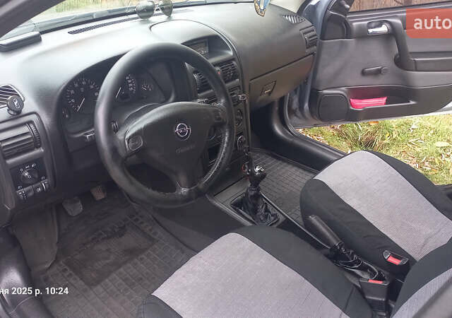 Серый Опель Астра, объемом двигателя 1.4 л и пробегом 212 тыс. км за 3900 $, фото 6 на Automoto.ua