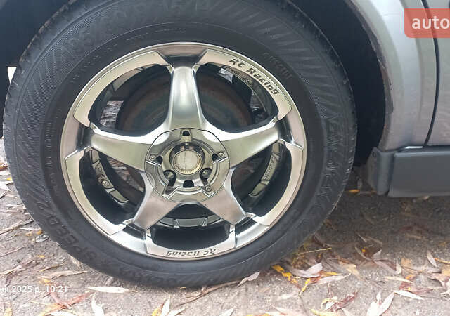 Серый Опель Астра, объемом двигателя 1.4 л и пробегом 212 тыс. км за 3900 $, фото 10 на Automoto.ua