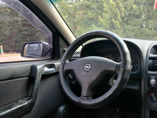 Серый Опель Астра, объемом двигателя 1.4 л и пробегом 260 тыс. км за 3590 $, фото 12 на Automoto.ua