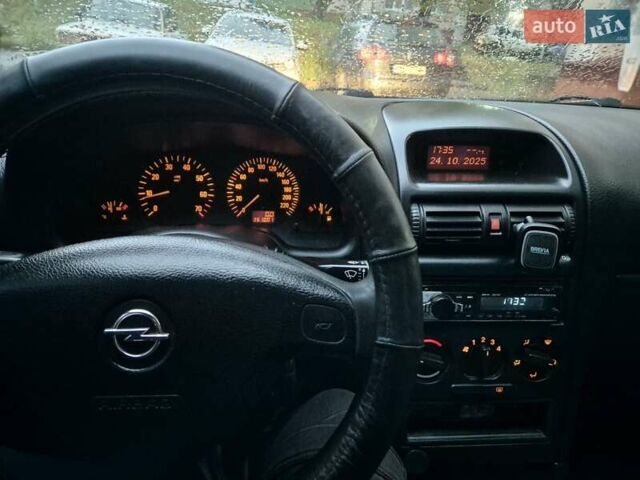 Серый Опель Астра, объемом двигателя 1.4 л и пробегом 361 тыс. км за 3800 $, фото 11 на Automoto.ua