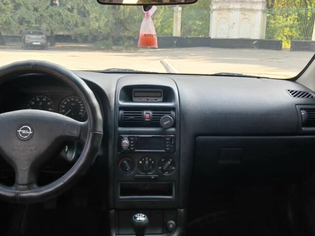 Серый Опель Астра, объемом двигателя 1.4 л и пробегом 260 тыс. км за 3590 $, фото 13 на Automoto.ua