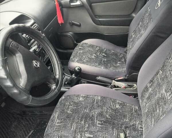 Серый Опель Астра, объемом двигателя 1.4 л и пробегом 201 тыс. км за 3100 $, фото 1 на Automoto.ua