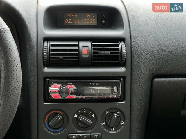 Серый Опель Астра, объемом двигателя 1.36 л и пробегом 77 тыс. км за 3999 $, фото 36 на Automoto.ua