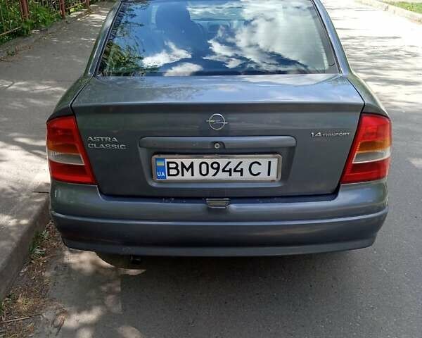 Серый Опель Астра, объемом двигателя 1.4 л и пробегом 207 тыс. км за 3100 $, фото 2 на Automoto.ua