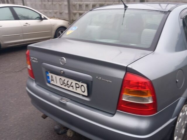 Серый Опель Астра, объемом двигателя 1.4 л и пробегом 256 тыс. км за 3200 $, фото 2 на Automoto.ua