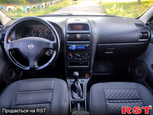 Серый Опель Астра, объемом двигателя 1.4 л и пробегом 198 тыс. км за 3500 $, фото 9 на Automoto.ua