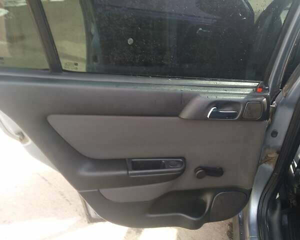 Серый Опель Астра, объемом двигателя 1.4 л и пробегом 278 тыс. км за 4000 $, фото 7 на Automoto.ua